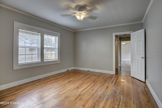 spare room featuring crown molding, ceiling fan, and light hardwood / wood-style flooring