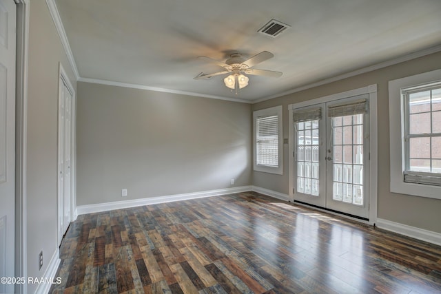 unfurnished room with ornamental molding, dark wood-type flooring, ceiling fan, and french doors