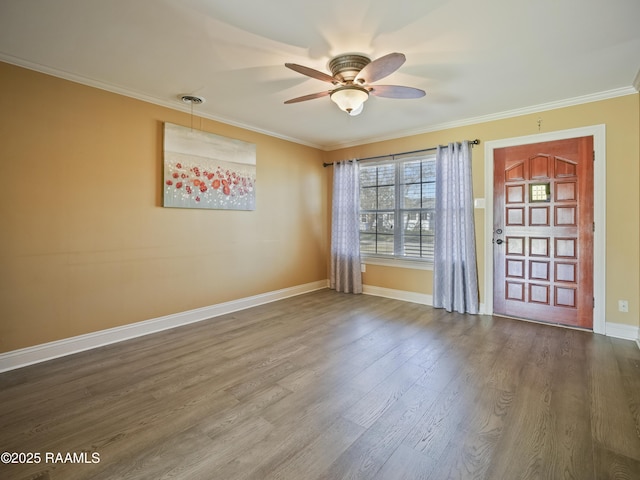 spare room featuring ceiling fan, hardwood / wood-style floors, and ornamental molding