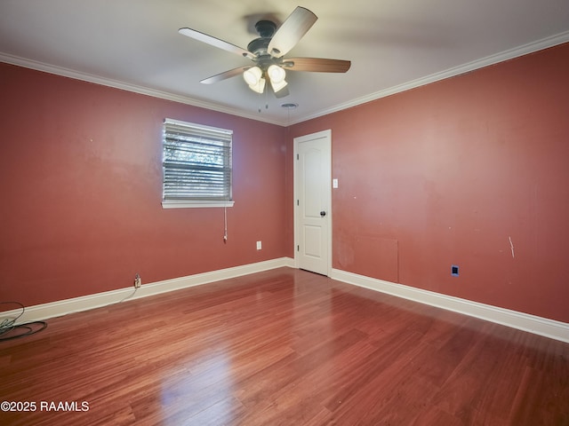 empty room featuring crown molding, hardwood / wood-style flooring, and ceiling fan