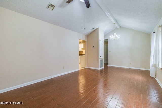 unfurnished living room featuring ceiling fan with notable chandelier, hardwood / wood-style floors, a textured ceiling, and vaulted ceiling with beams