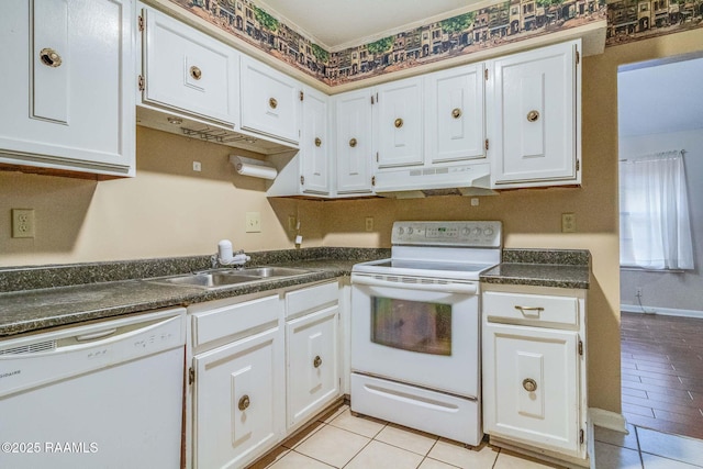 kitchen featuring white cabinetry, white appliances, and sink