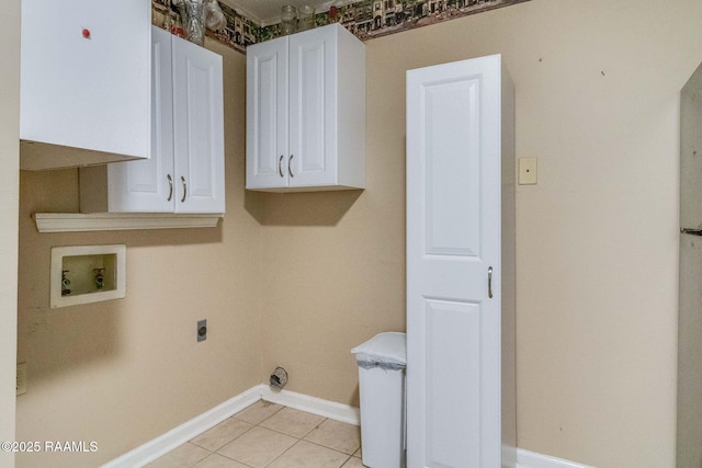 laundry room with hookup for a washing machine, hookup for an electric dryer, cabinets, and light tile patterned floors