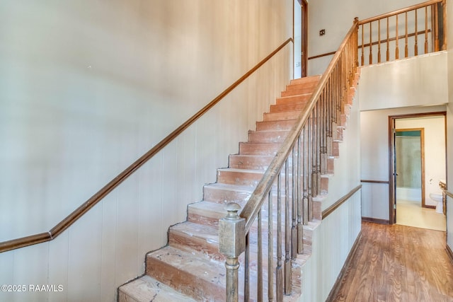 stairway featuring wood finished floors