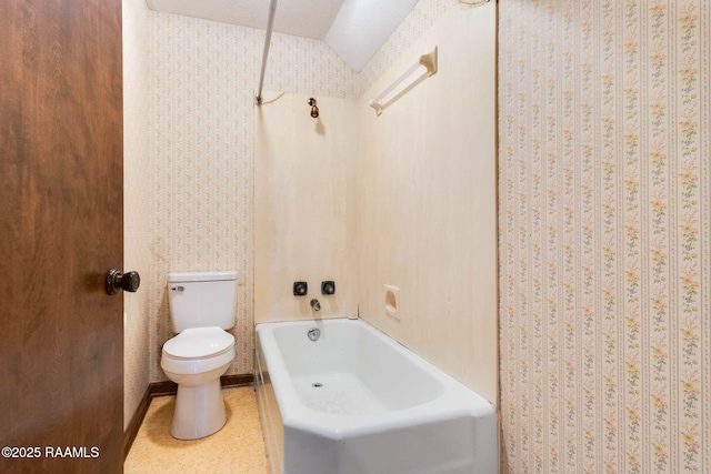 full bath featuring toilet, bathtub / shower combination, and vaulted ceiling