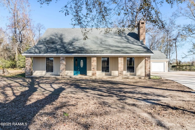 view of front of property featuring a porch and a garage