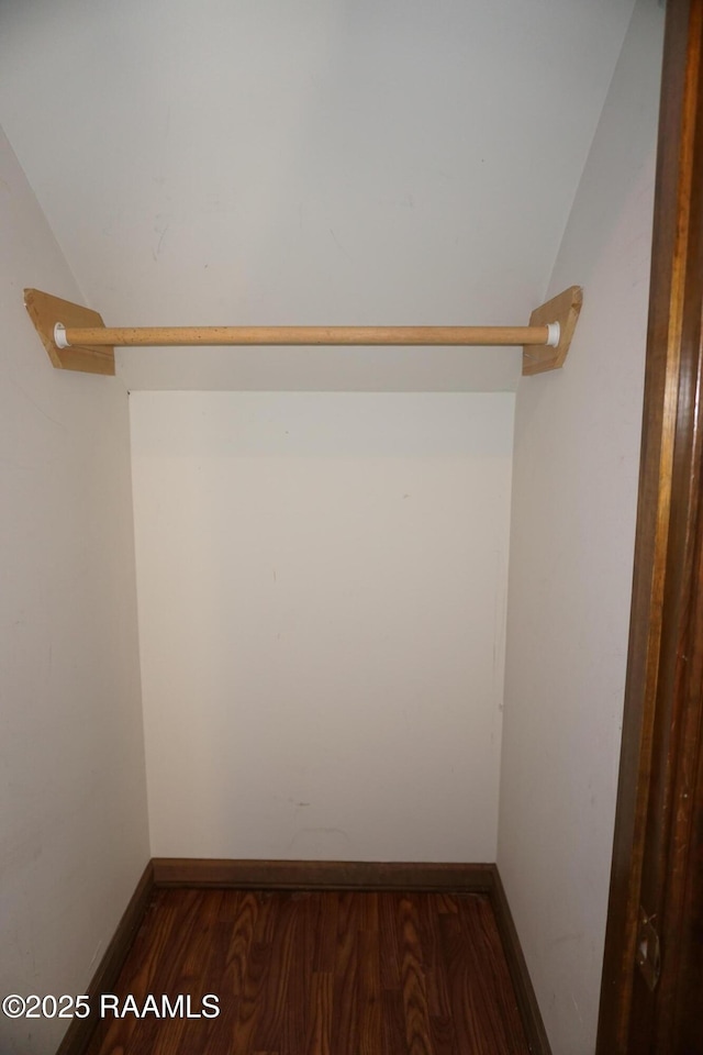 spacious closet with wood finished floors