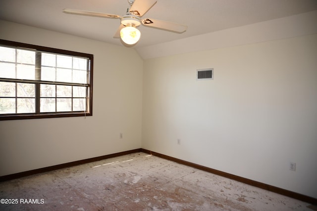 empty room with visible vents, baseboards, lofted ceiling, and ceiling fan