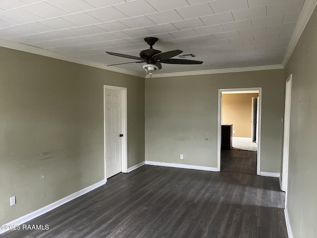 spare room featuring crown molding, dark hardwood / wood-style floors, and ceiling fan