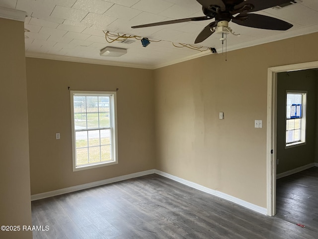 unfurnished room featuring crown molding, dark wood-type flooring, and ceiling fan