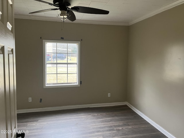 unfurnished room with dark wood-type flooring, ceiling fan, and crown molding