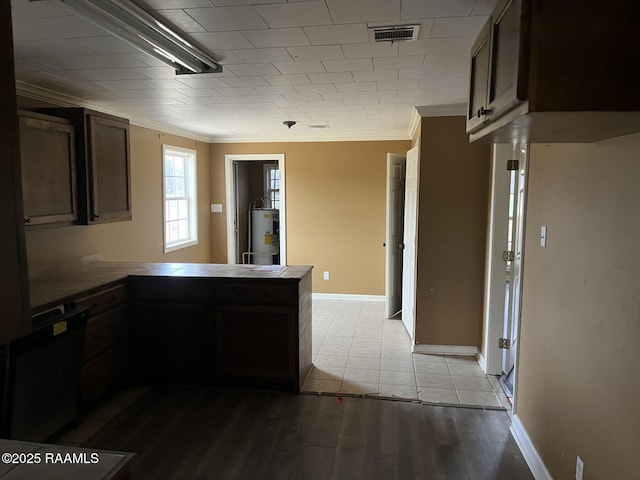 kitchen with water heater, ornamental molding, light wood-type flooring, and kitchen peninsula