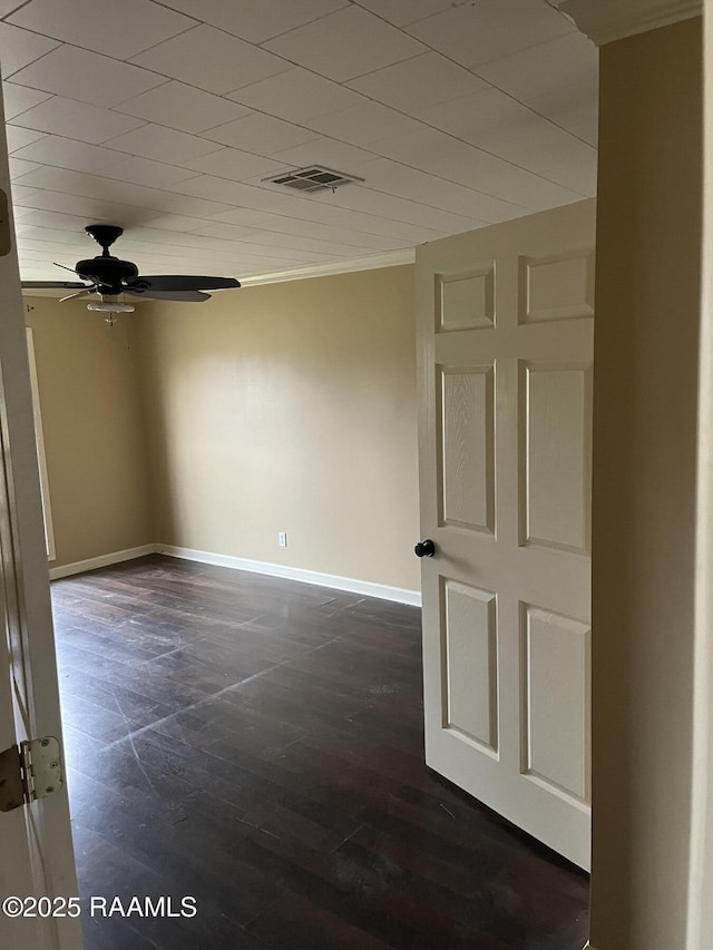 spare room featuring ceiling fan and ornamental molding