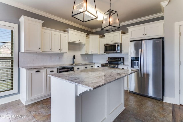 kitchen featuring a kitchen island, white cabinetry, appliances with stainless steel finishes, and pendant lighting