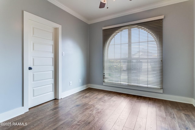 spare room featuring hardwood / wood-style flooring, crown molding, and ceiling fan