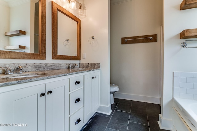 bathroom featuring vanity, a bathing tub, crown molding, and toilet