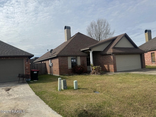 ranch-style house featuring a garage and a front lawn