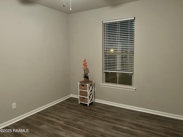 empty room featuring dark hardwood / wood-style floors