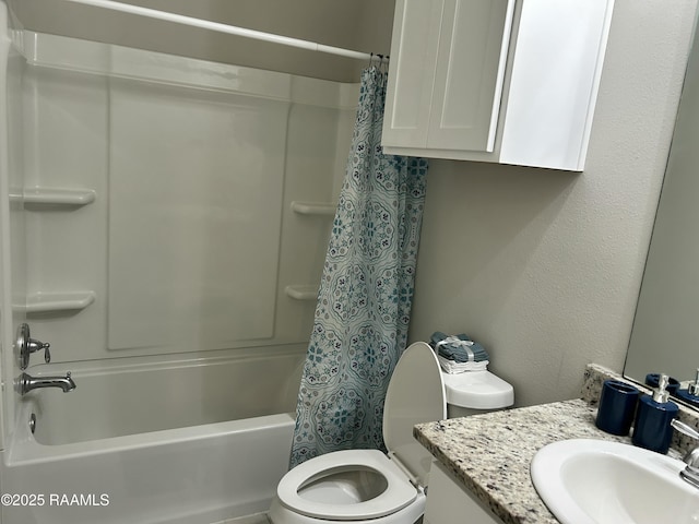 full bathroom with shower / tub combo with curtain, vanity, and toilet