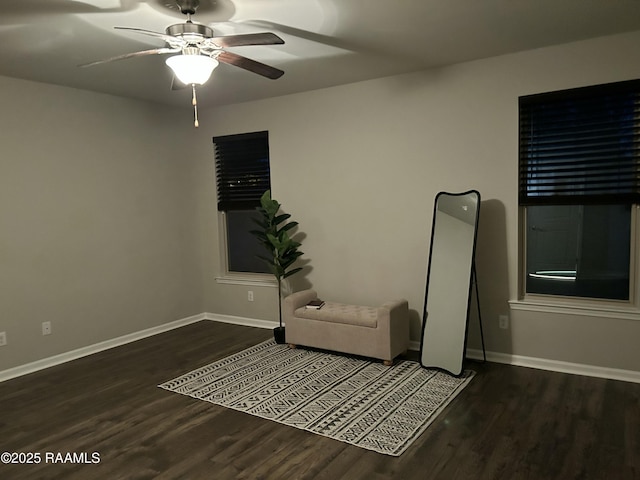 unfurnished room featuring ceiling fan and dark hardwood / wood-style floors