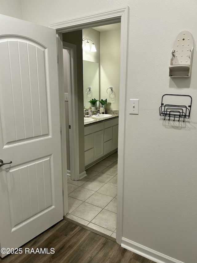 bathroom featuring wood-type flooring and vanity