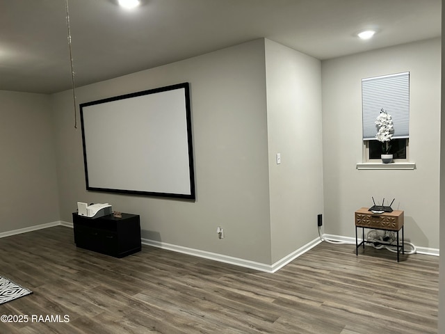 home theater room with hardwood / wood-style flooring