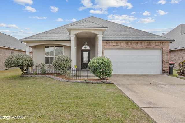 view of front of property with a garage and a front yard