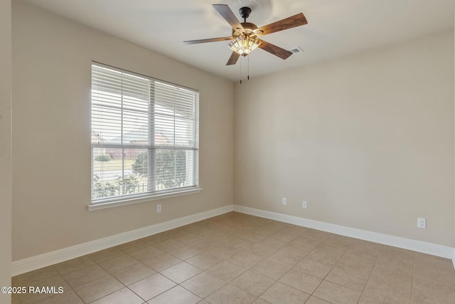 tiled empty room with ceiling fan