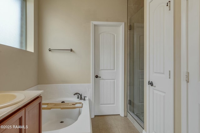 bathroom with vanity and independent shower and bath