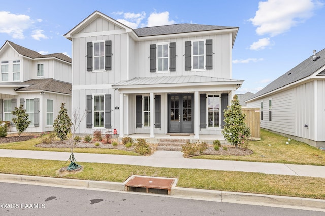 view of front of house with a front lawn and a porch