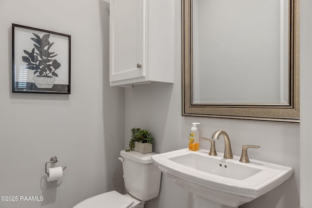 bathroom featuring sink and toilet