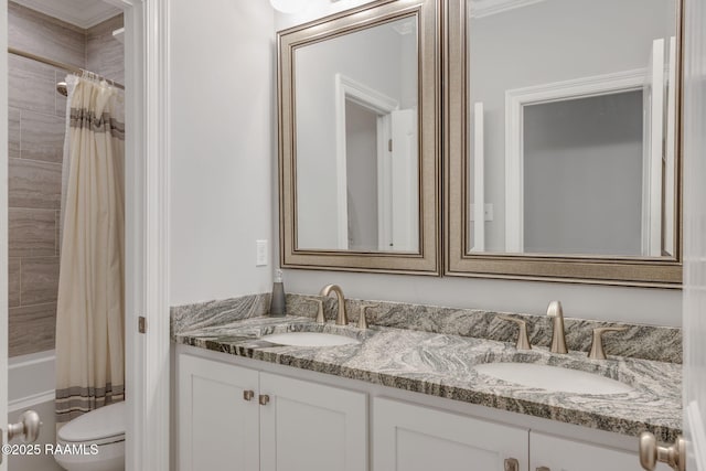 full bathroom featuring vanity, toilet, and shower / tub combo