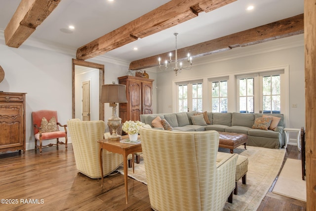 living room with crown molding, beam ceiling, a notable chandelier, and light wood-type flooring