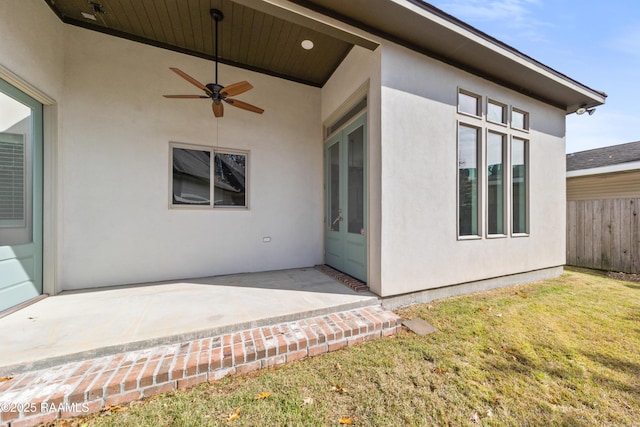 exterior space featuring ceiling fan