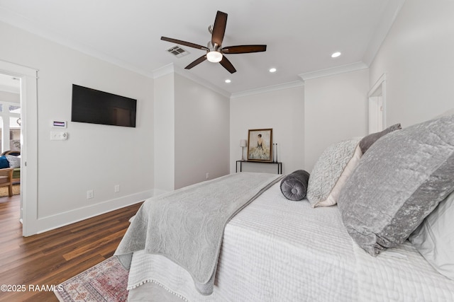 bedroom featuring ornamental molding, dark hardwood / wood-style floors, and ceiling fan