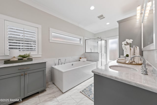 bathroom with vanity, separate shower and tub, and crown molding