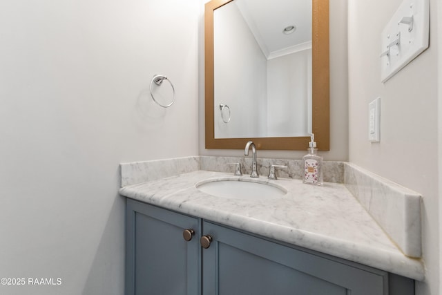 bathroom with vanity and ornamental molding