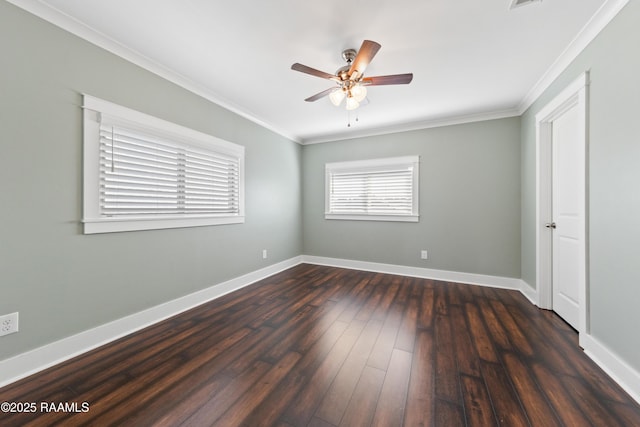 unfurnished bedroom with ornamental molding, dark wood-type flooring, and ceiling fan