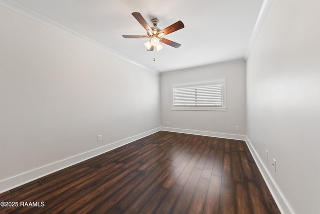 spare room featuring dark wood-type flooring, ceiling fan, and ornamental molding