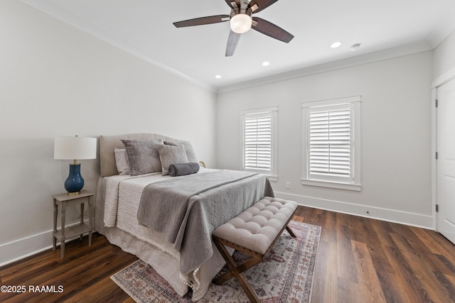 bedroom featuring dark wood-type flooring, ornamental molding, and ceiling fan