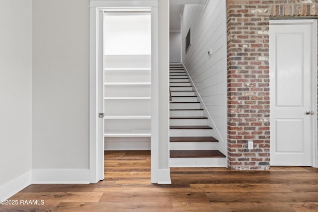 stairs with wood-type flooring