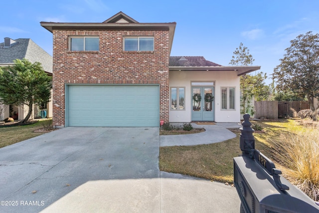 view of property featuring a garage and french doors