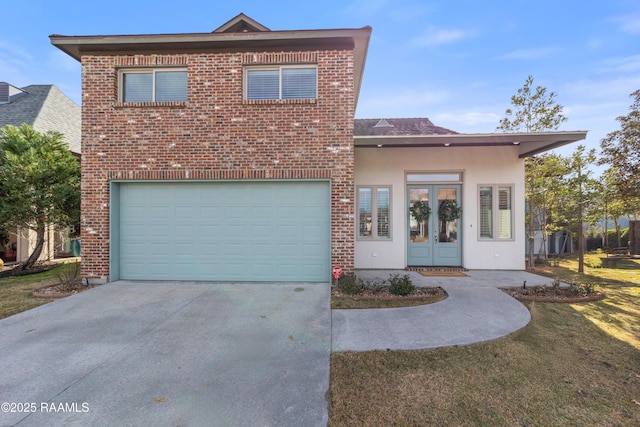 front facade featuring a garage and a front yard