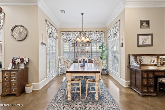 dining space featuring ornamental molding and a chandelier