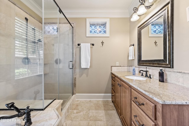 bathroom featuring ornamental molding, a shower with shower door, vanity, and a wealth of natural light