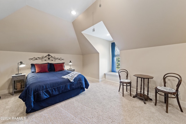 carpeted bedroom featuring lofted ceiling