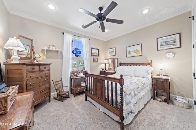 bedroom featuring crown molding, light colored carpet, and ceiling fan