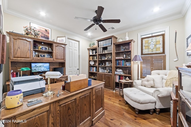 office space featuring ceiling fan, ornamental molding, and light wood-type flooring