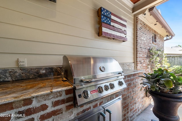 view of patio / terrace featuring exterior kitchen and area for grilling