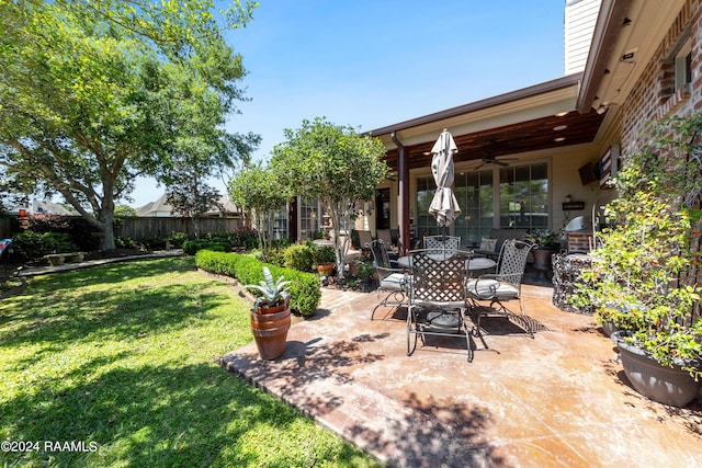 view of patio / terrace featuring ceiling fan